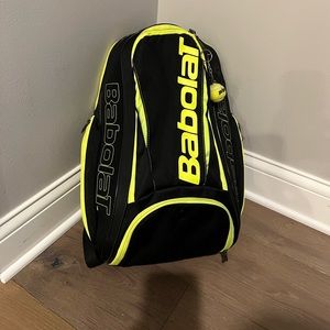 Gently used black  and yellow Babolat tennis backpack.l
